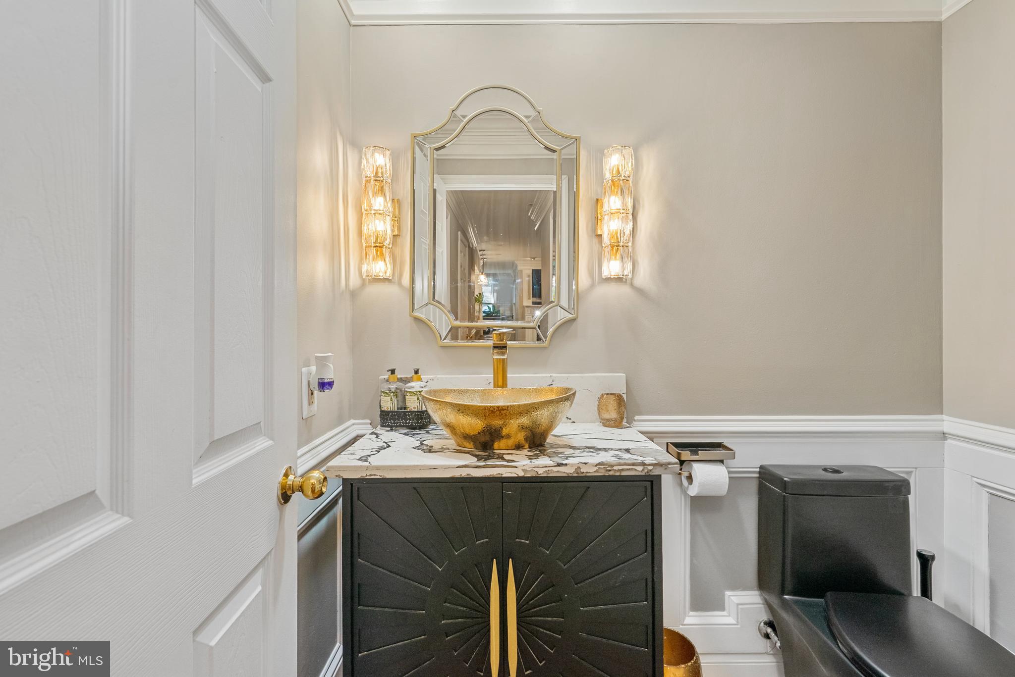 6202 State Street Cheverly, MD 20785 - Photo 32 of 34 a bathroom with a sink and a mirror