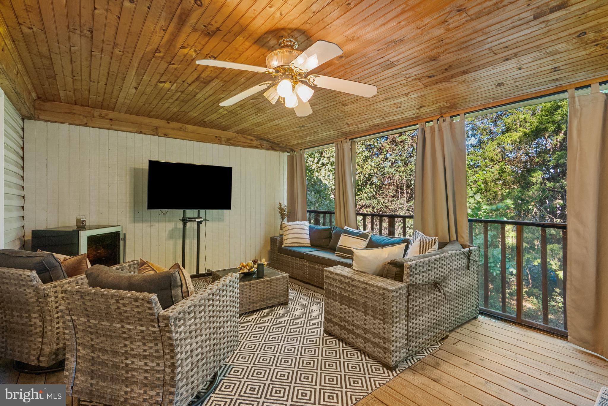 6202 State Street Cheverly, MD 20785 - Photo 33 of 34 a living room with furniture and a flat screen tv