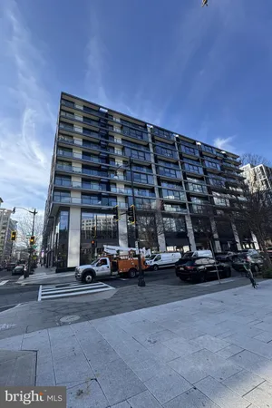 a view of cars parked in front of a building