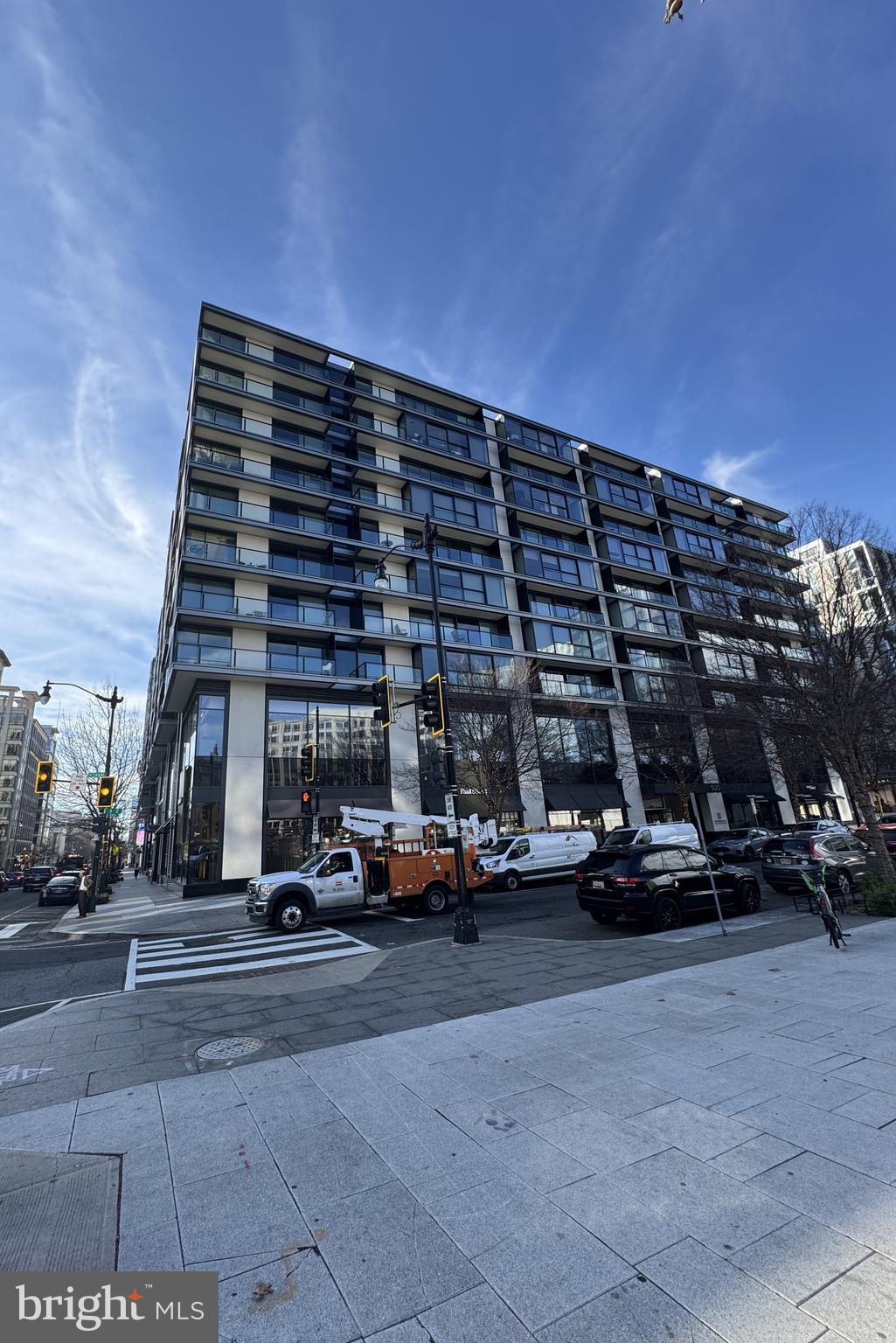 a view of cars parked in front of a building
