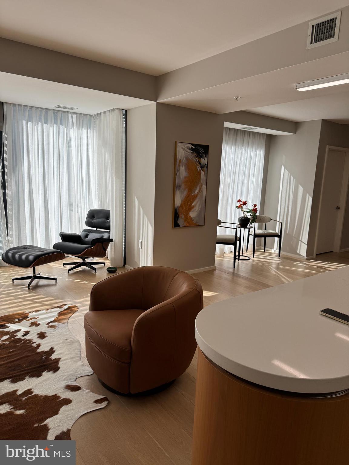 920 I Street Northwest, Unit 504505 Washington, DC 20001 - Photo 11 of 17 a living room with furniture and a window