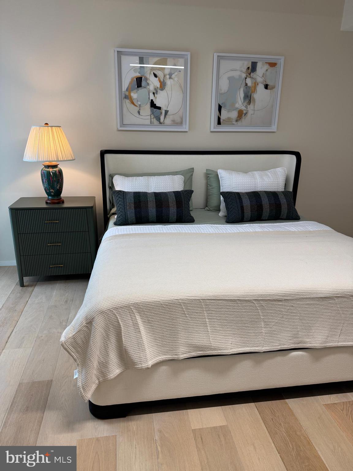 920 I Street Northwest, Unit 504505 Washington, DC 20001 - Photo 12 of 17 a bedroom with a bed and a painting on the wall