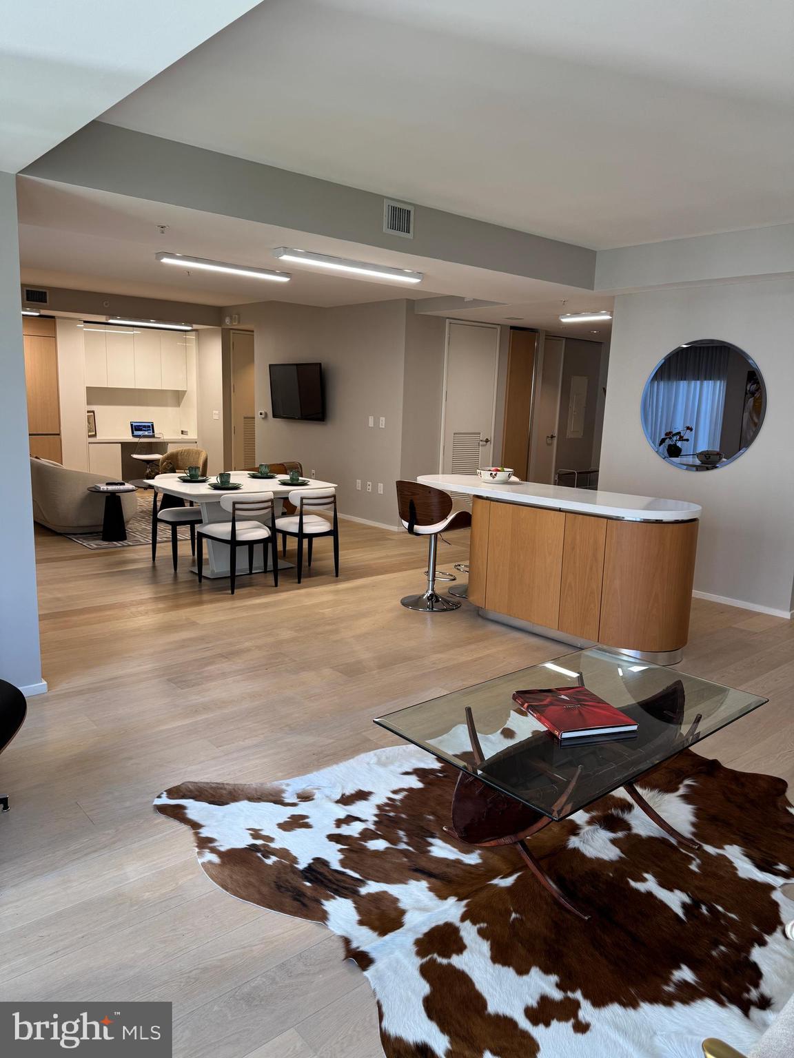 920 I Street Northwest, Unit 504505 Washington, DC 20001 - Photo 3 of 17 a living room with lots of furniture and kitchen view