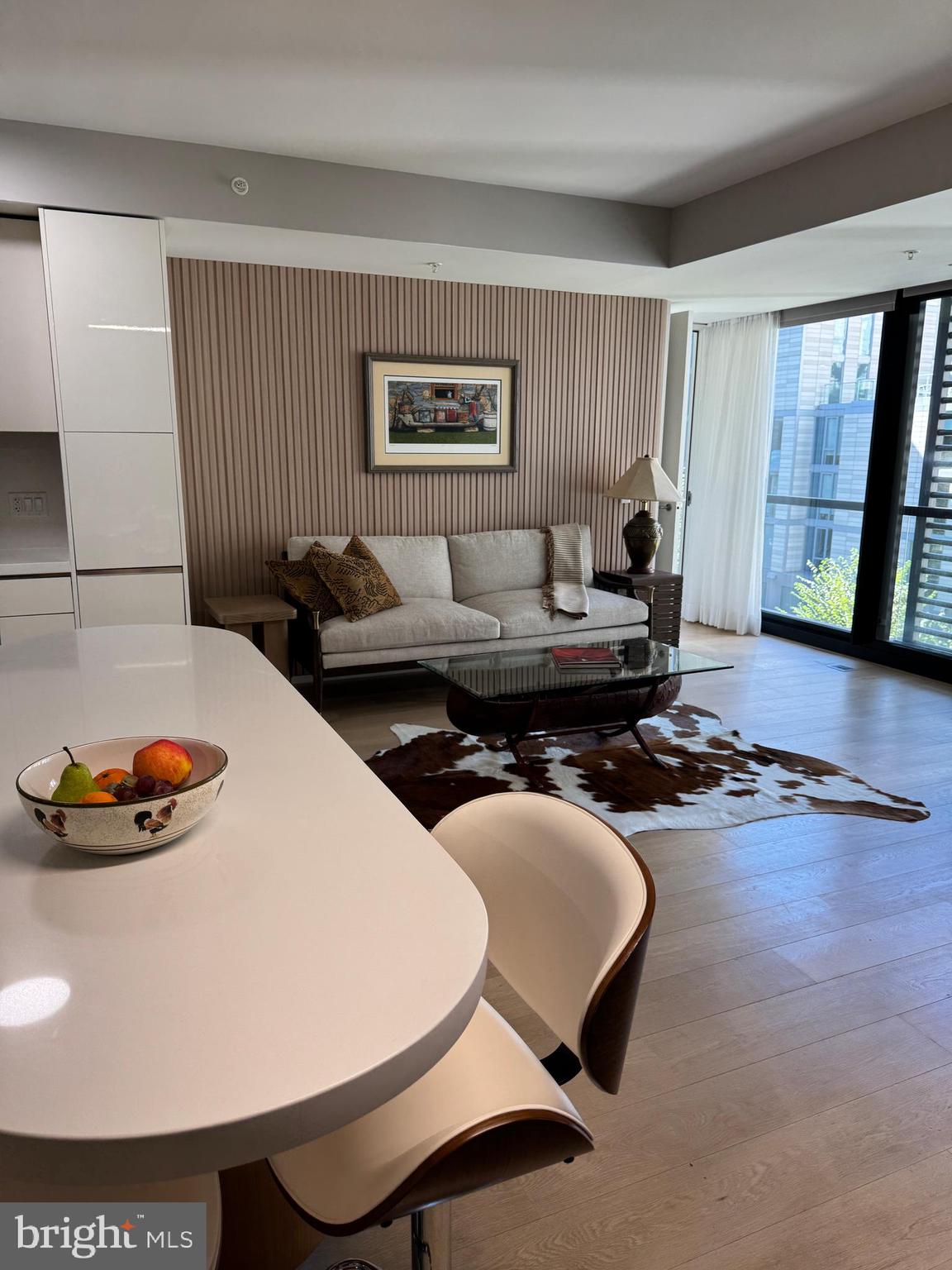 920 I Street Northwest, Unit 504505 Washington, DC 20001 - Photo 6 of 17 a living room with furniture and large window