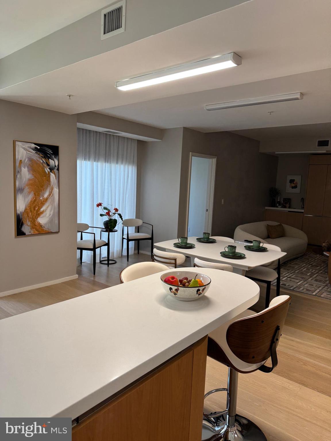 920 I Street Northwest, Unit 504505 Washington, DC 20001 - Photo 7 of 17 a dining room with furniture and wooden floor