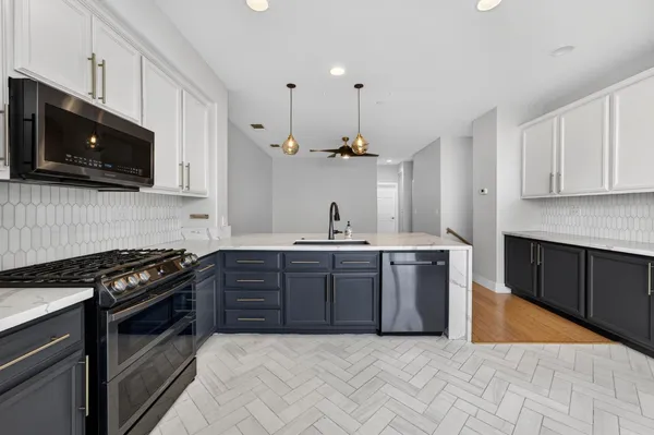 a bathroom with a sink toilet vanity and shower
