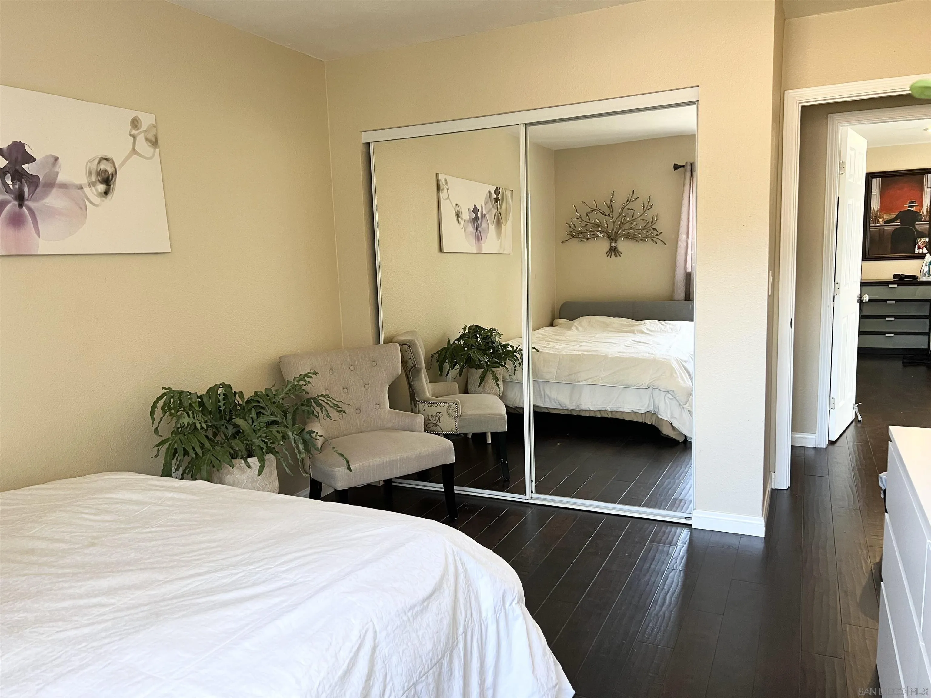 9849 Chestnut Street Spring Valley, CA 91977 - Photo 13 of 27 a bedroom with a bed and a painting on the wall