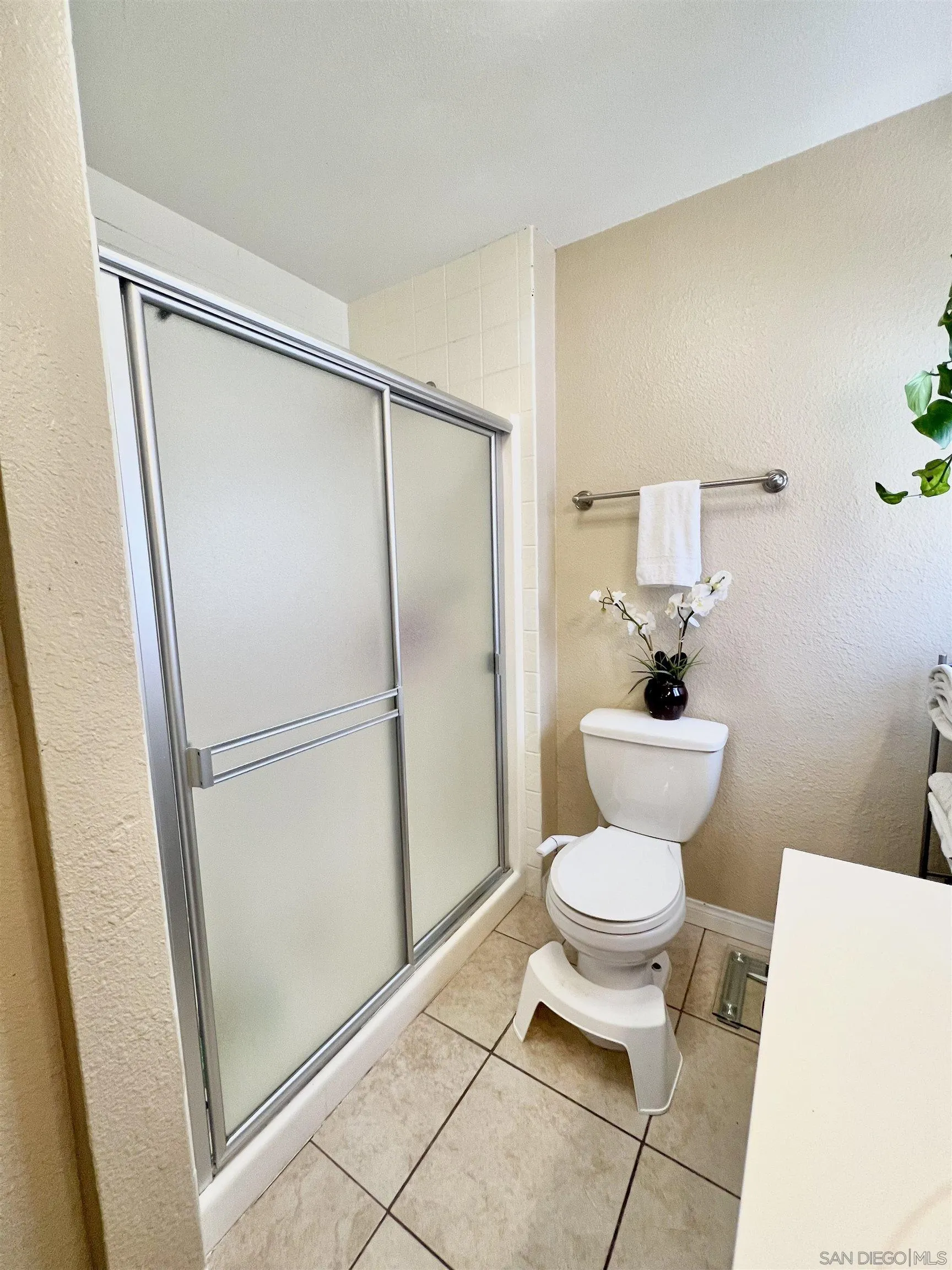 9849 Chestnut Street Spring Valley, CA 91977 - Photo 20 of 27 a bathroom with a toilet and a shower