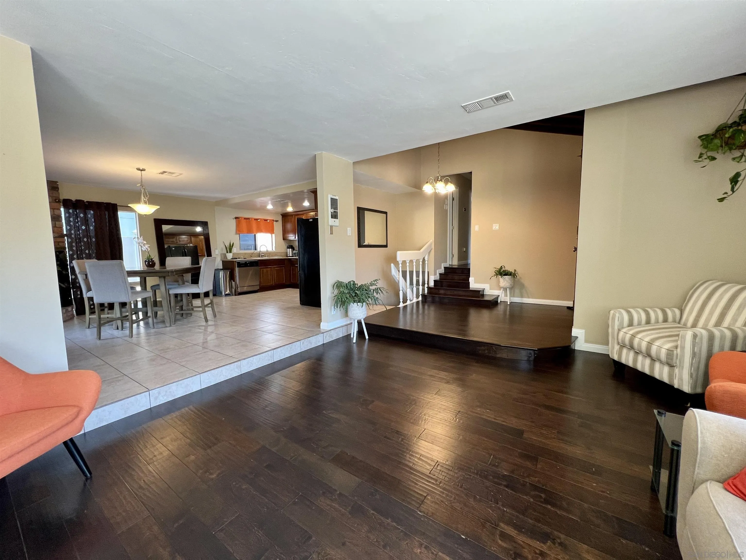 9849 Chestnut Street Spring Valley, CA 91977 - Photo 5 of 27 a living room with furniture and a wooden floor