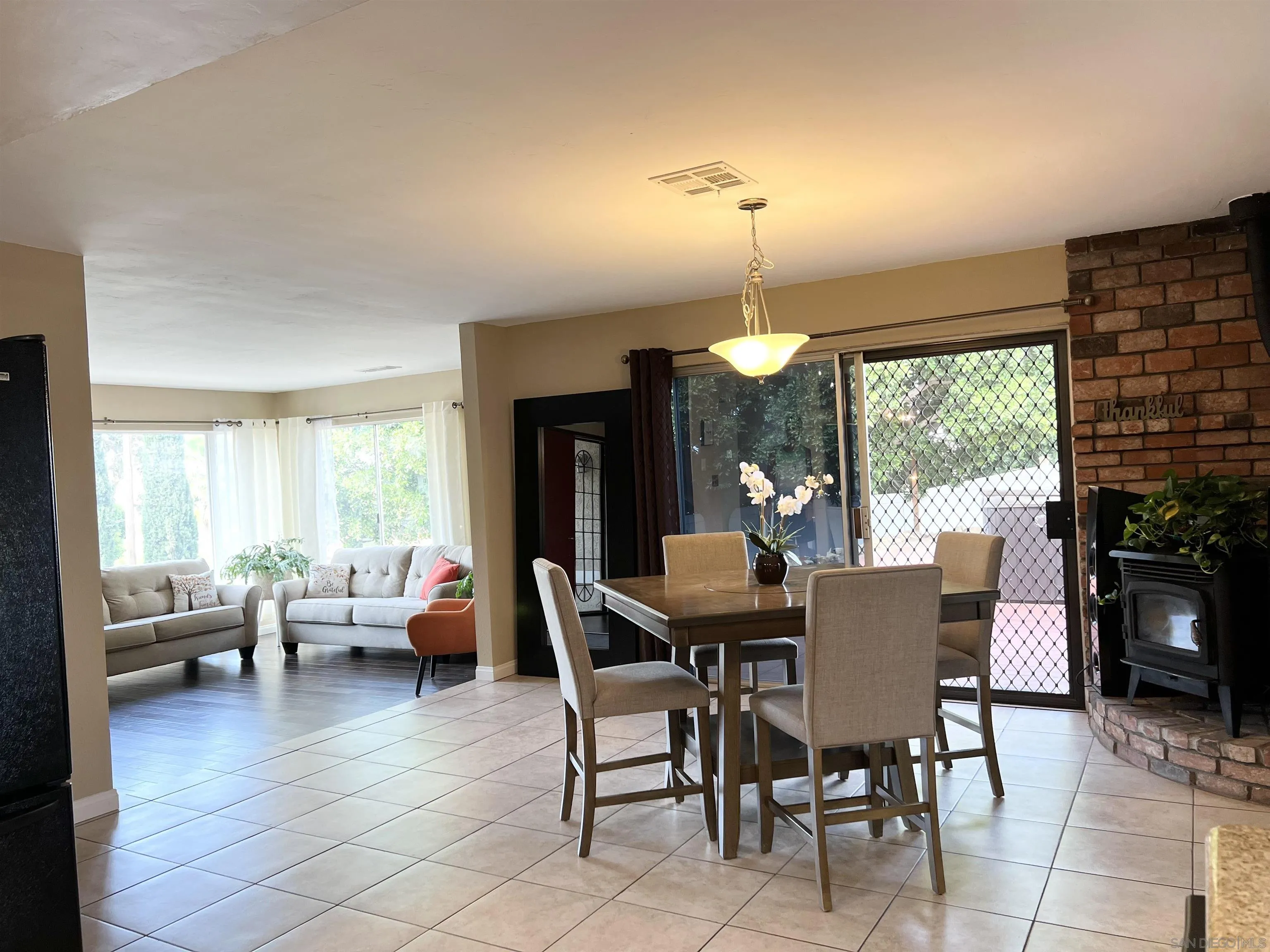 9849 Chestnut Street Spring Valley, CA 91977 - Photo 7 of 27 a view of a dining room with furniture window and outside view