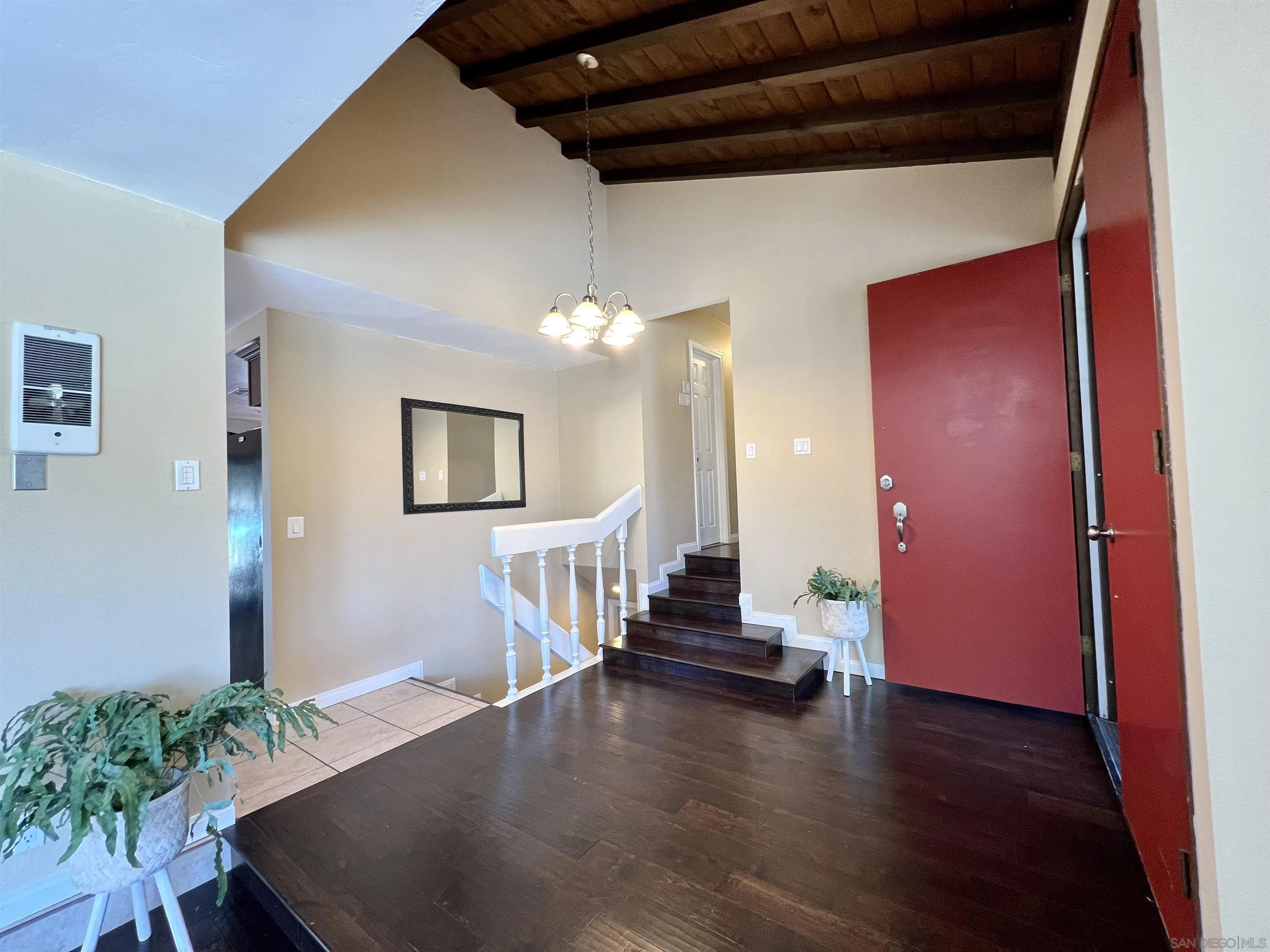 9849 Chestnut Street Spring Valley, CA 91977 - Photo 10 of 27 a view of a livingroom with wooden floor and stairs