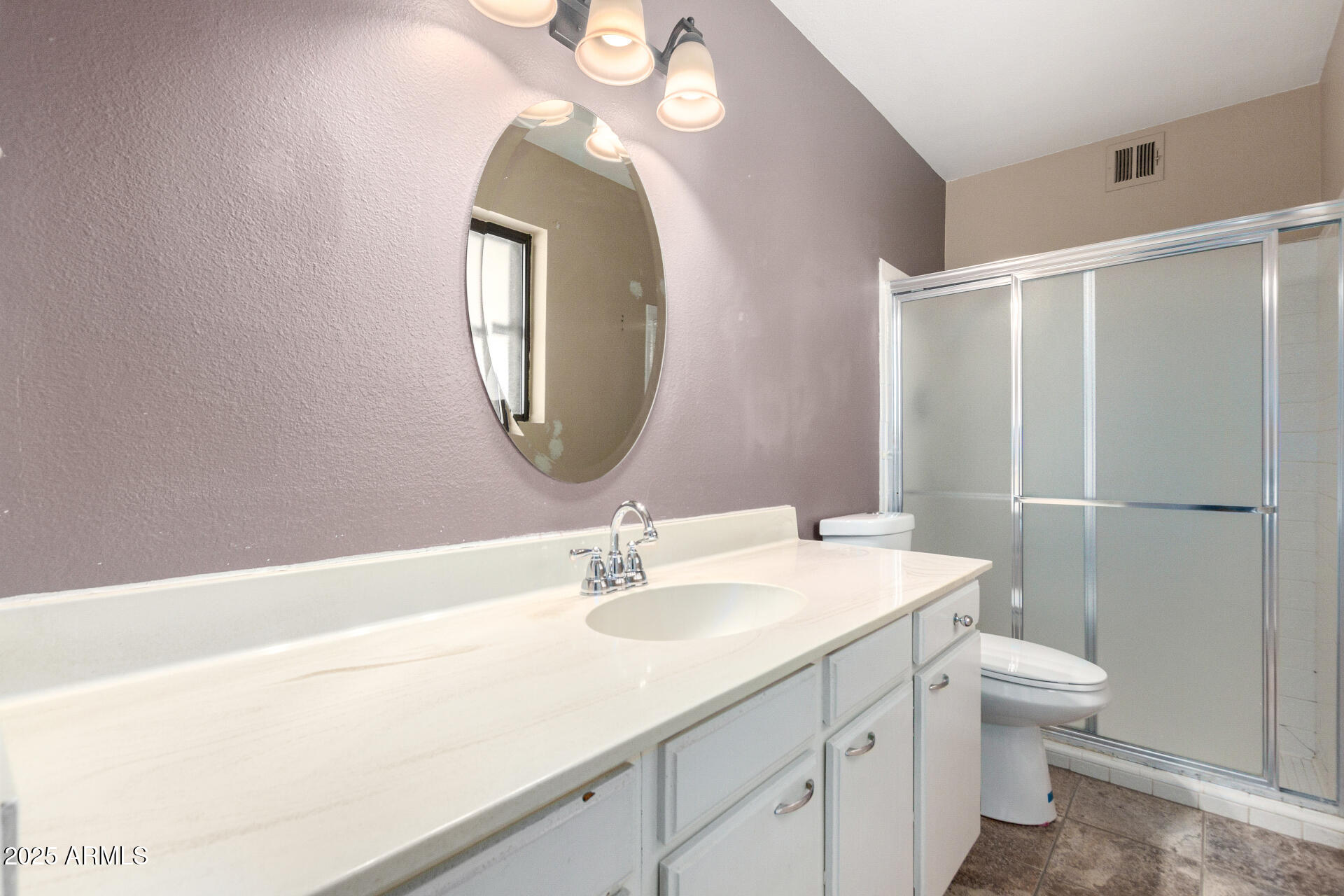 4740 West Bloomfield Road Glendale, AZ 85304 - Photo 19 of 34 a bathroom with a sink a toilet and a mirror