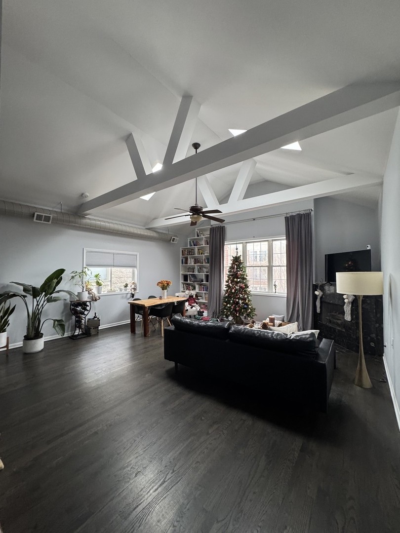 2315 West Harrison Street, Unit 4 Chicago, IL 60612 - Photo 2 of 9 a living room with furniture and a large window