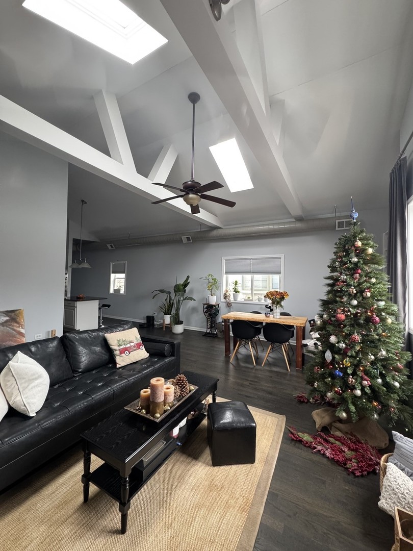 2315 West Harrison Street, Unit 4 Chicago, IL 60612 - Photo 3 of 9 a living room with furniture and flowers