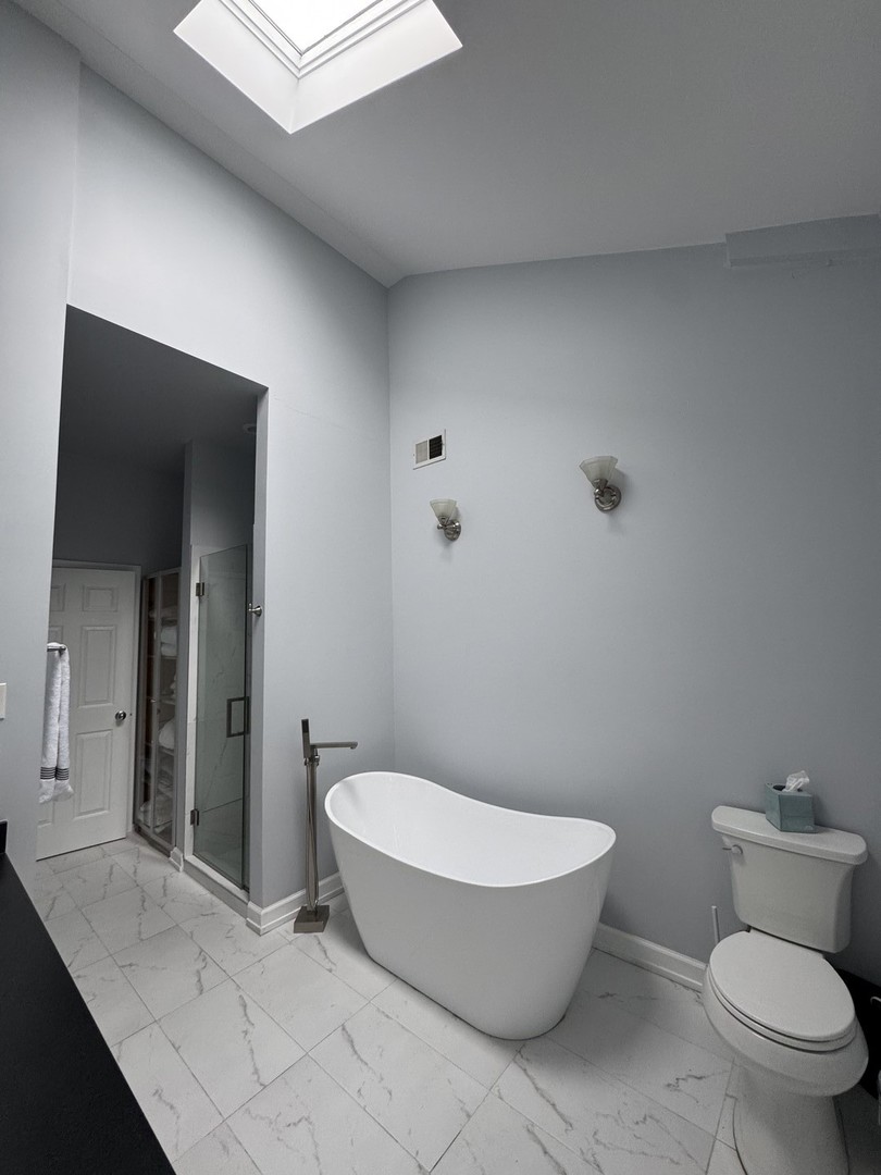 2315 West Harrison Street, Unit 4 Chicago, IL 60612 - Photo 8 of 9 a bathroom with a toilet and a sink