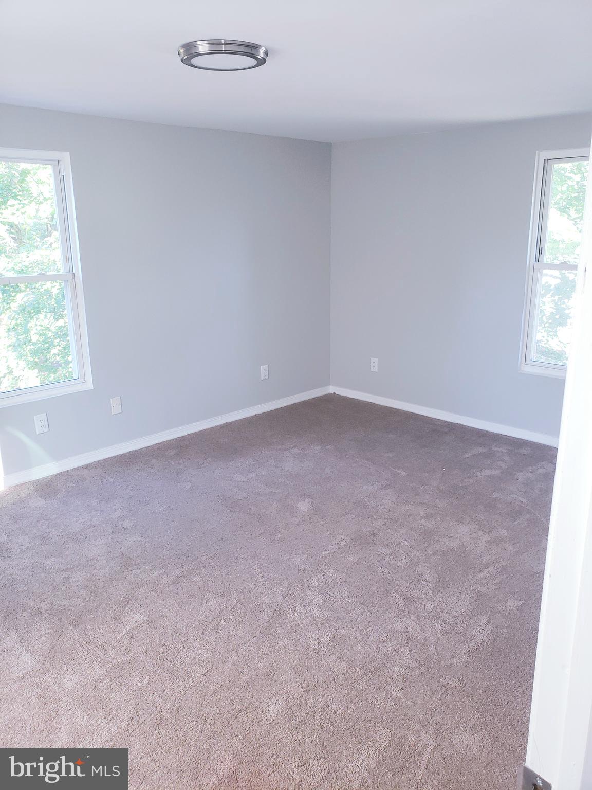 595 Berlin Road Clementon, NJ 08021 - Photo 12 of 24 an empty room with windows