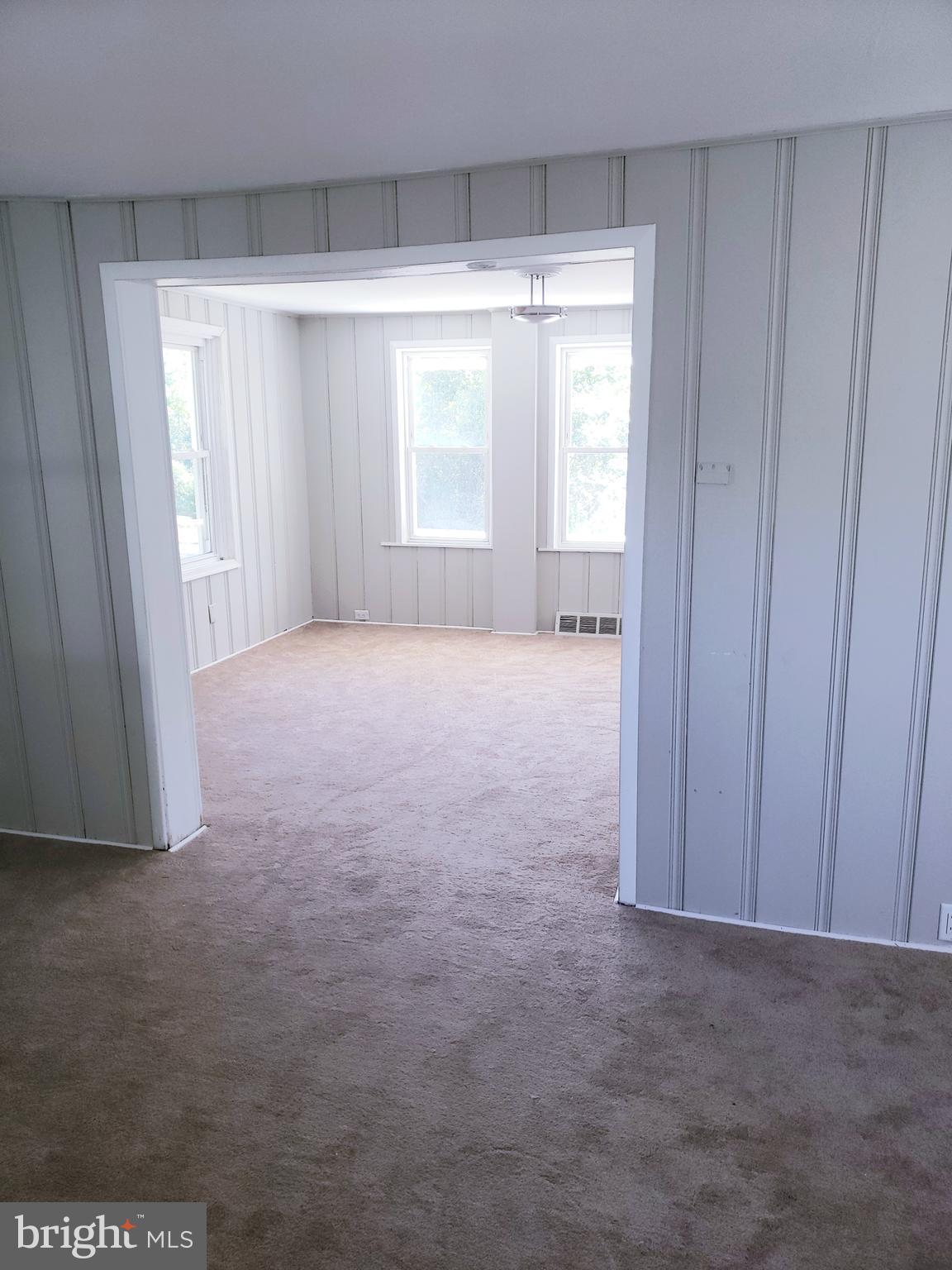 595 Berlin Road Clementon, NJ 08021 - Photo 5 of 24 a view of an empty room with a window