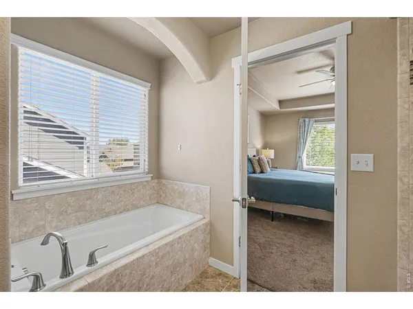 a bathroom with a double vanity sink mirror and shower
