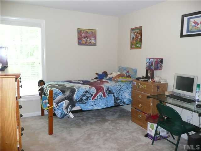 2812 Kissing Court Raleigh, NC 27613 - Photo 14 of 24 Another secondary bedroom with plenty of light and closet space! Bedroom
