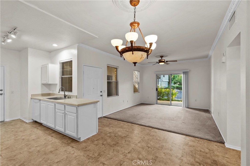 20000 Plum Canyon Road, Unit 1316 Saugus, CA 91350 - Photo 11 of 37 a view of a kitchen with a sink and chandelier