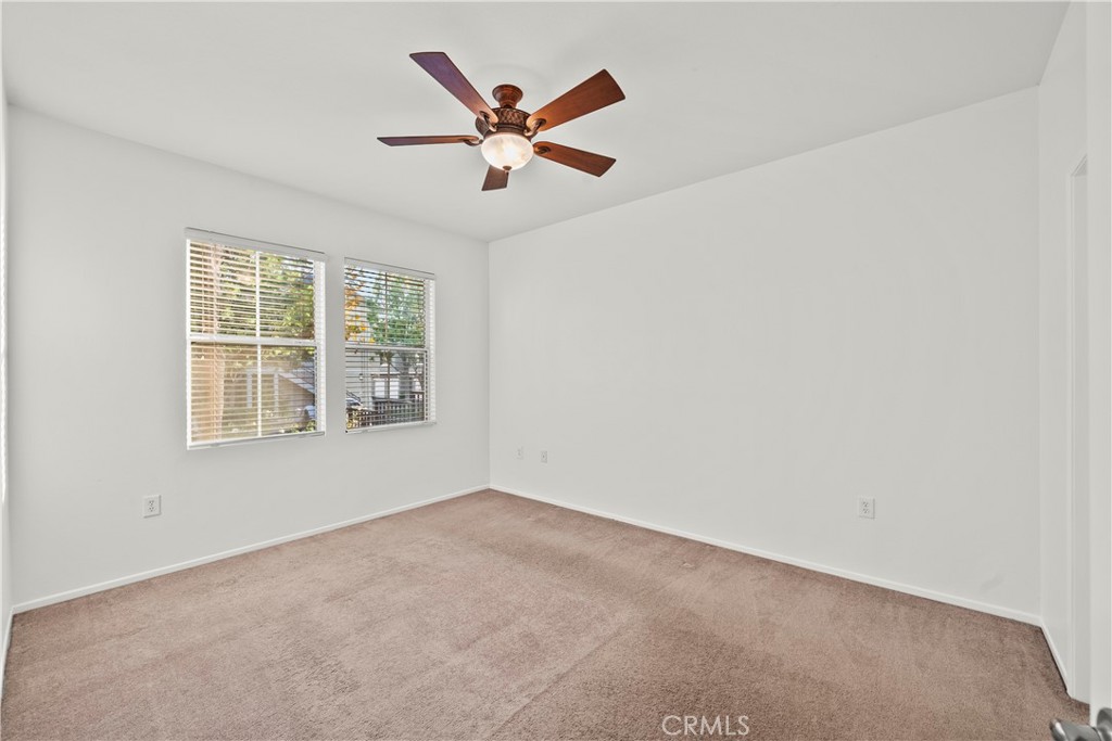 20000 Plum Canyon Road, Unit 1316 Saugus, CA 91350 - Photo 16 of 37 an empty room with a window and a ceiling fan
