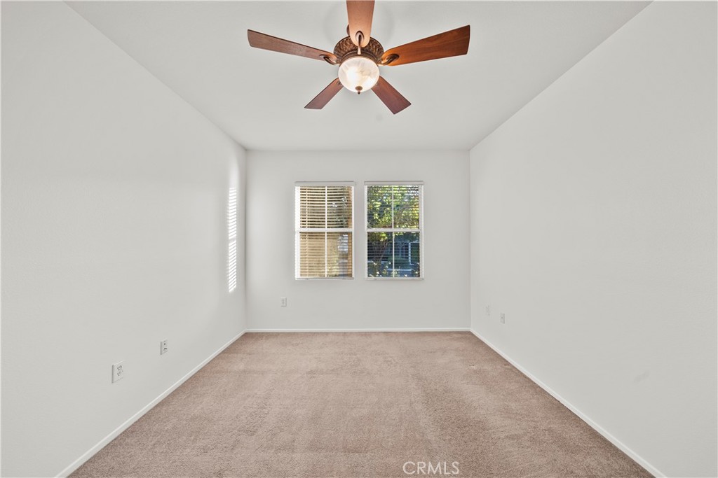 20000 Plum Canyon Road, Unit 1316 Saugus, CA 91350 - Photo 18 of 37 an empty room with windows and fan
