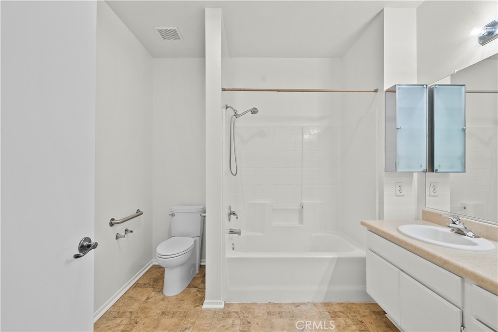 20000 Plum Canyon Road, Unit 1316 Saugus, CA 91350 - Photo 20 of 37 a bathroom with a tub sink toilet and a mirror