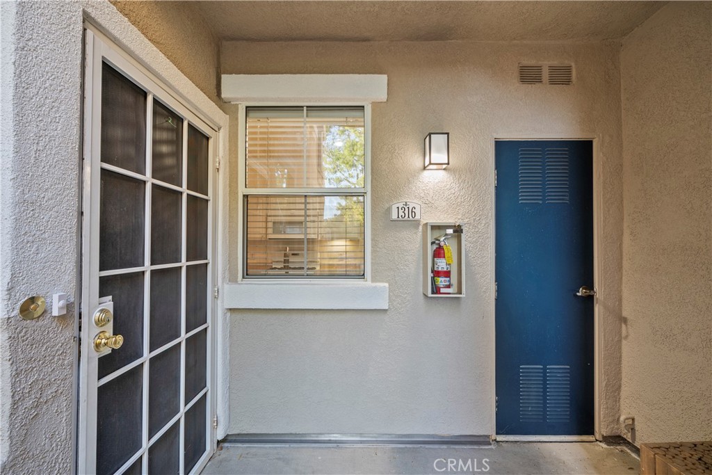 20000 Plum Canyon Road, Unit 1316 Saugus, CA 91350 - Photo 2 of 37 a view of an entryway with wooden floor