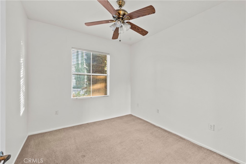 20000 Plum Canyon Road, Unit 1316 Saugus, CA 91350 - Photo 21 of 37 an empty room with a window and a fan