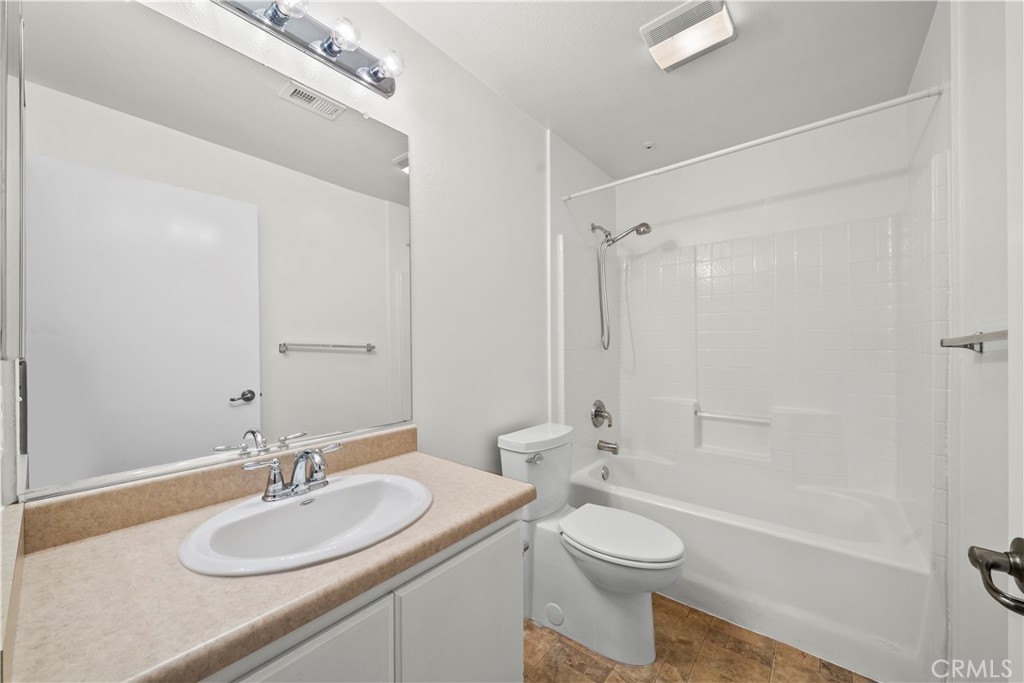 20000 Plum Canyon Road, Unit 1316 Saugus, CA 91350 - Photo 23 of 37 a bathroom with a sink a toilet and shower