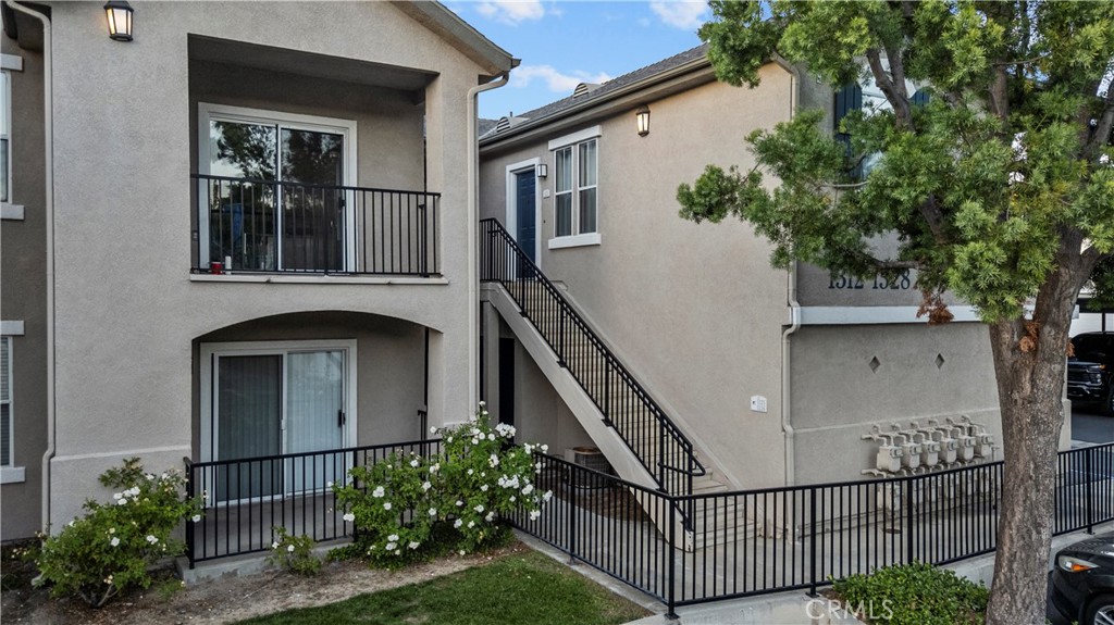 20000 Plum Canyon Road, Unit 1316 Saugus, CA 91350 - Photo 34 of 37 a front view of a house with entryway