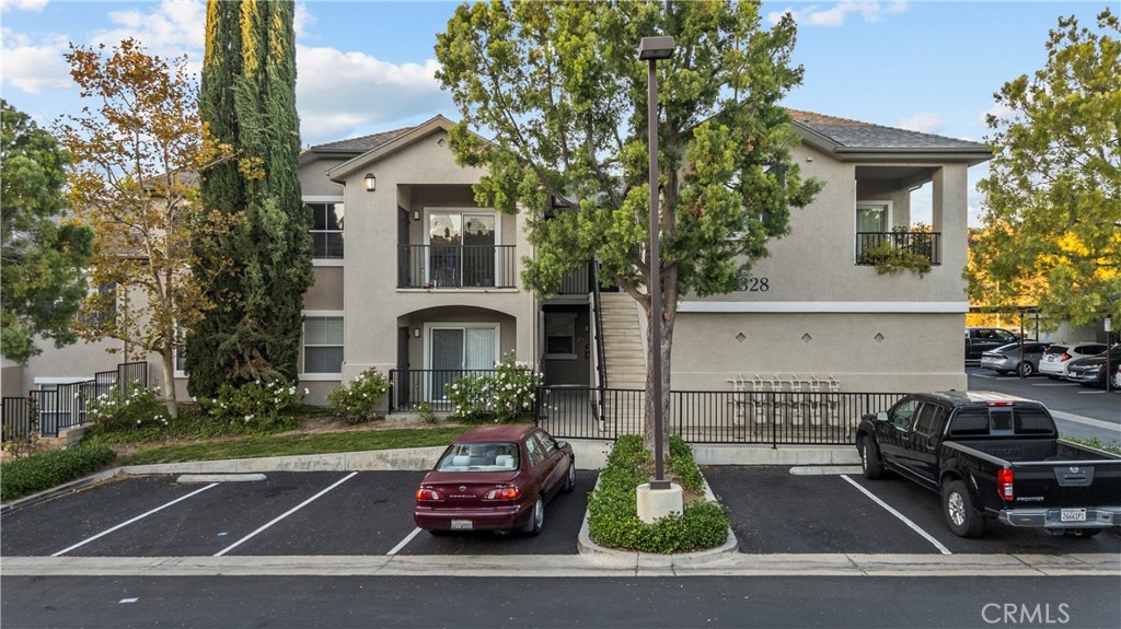 20000 Plum Canyon Road, Unit 1316 Saugus, CA 91350 - Photo 36 of 37 a car parked in front of a house