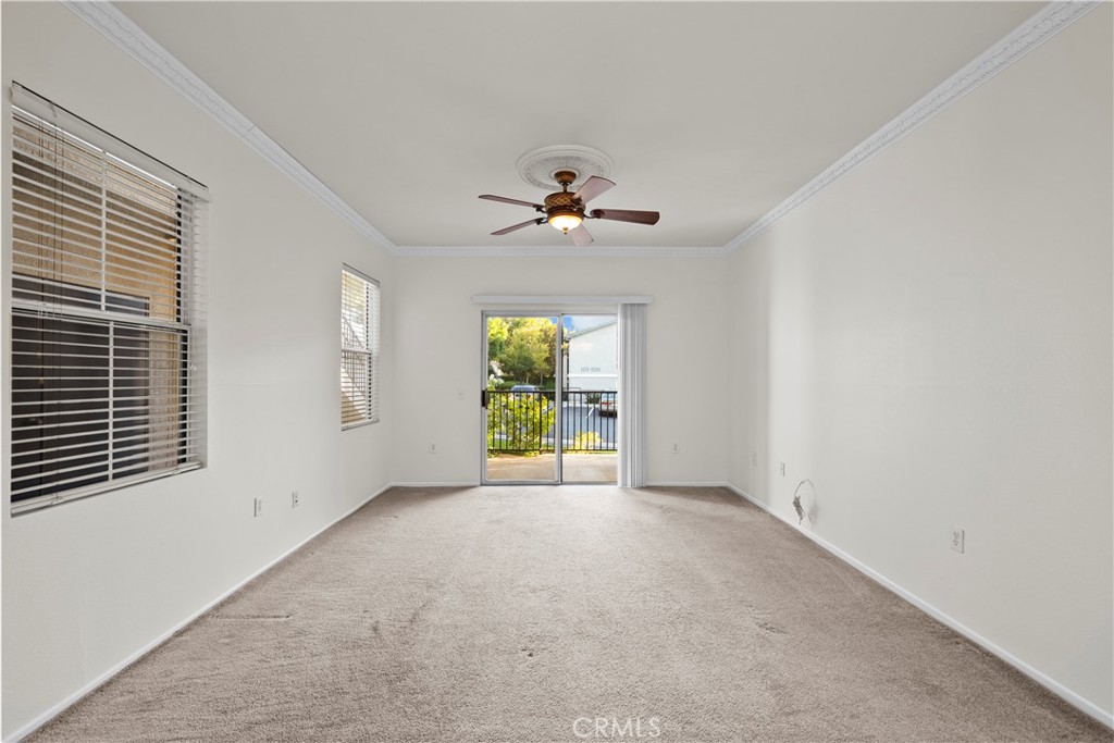 20000 Plum Canyon Road, Unit 1316 Saugus, CA 91350 - Photo 4 of 37 wooden floor in an empty room with a window