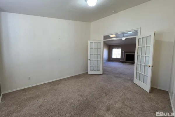 a view of a hallway with entryway to a bedroom