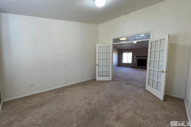 a view of a hallway with entryway to a bedroom