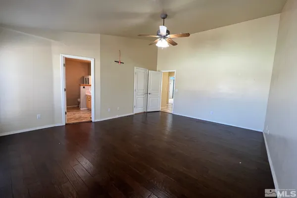 an empty room with wooden floor