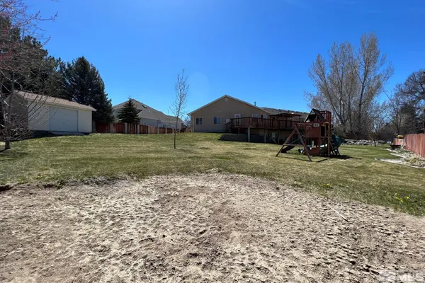 a swimming pool with wooden fence
