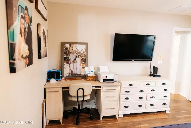 a view of a livingroom with furniture and flat screen tv