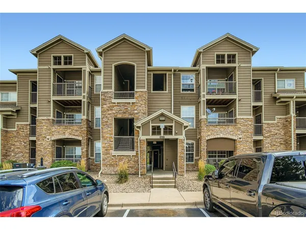 a front view of a house with yard