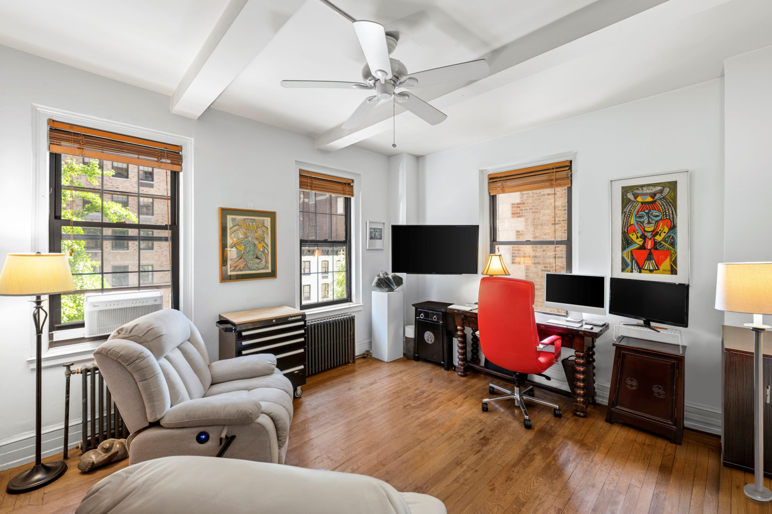 444 East 57th Street, Unit 5B Manhattan, NY 10022 - Photo 4 of 12 a livingroom with workspace and a window