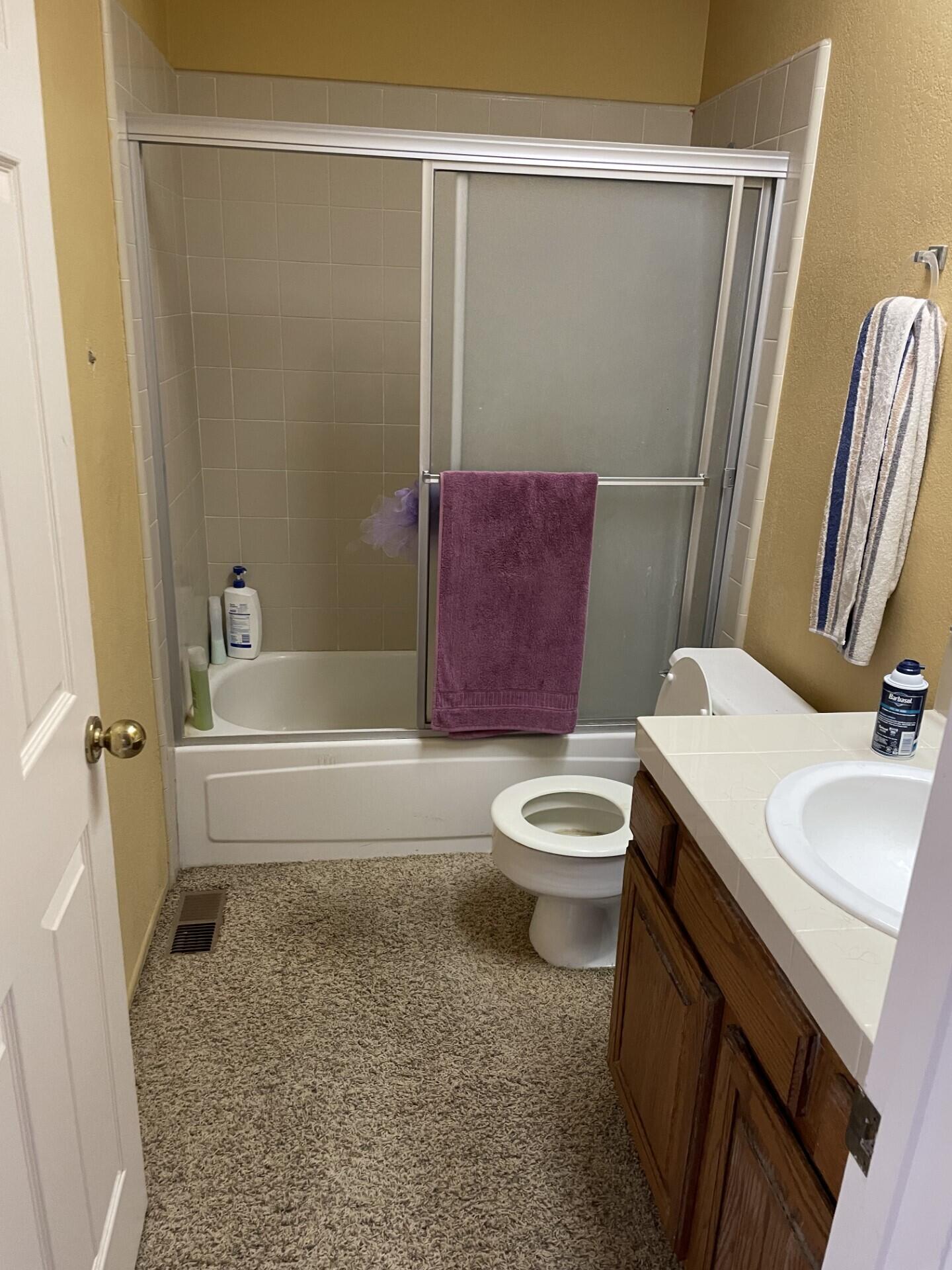 702 Hillside Drive Solvang, CA 93463 - Photo 11 of 15 a bathroom with a sink a toilet and shower