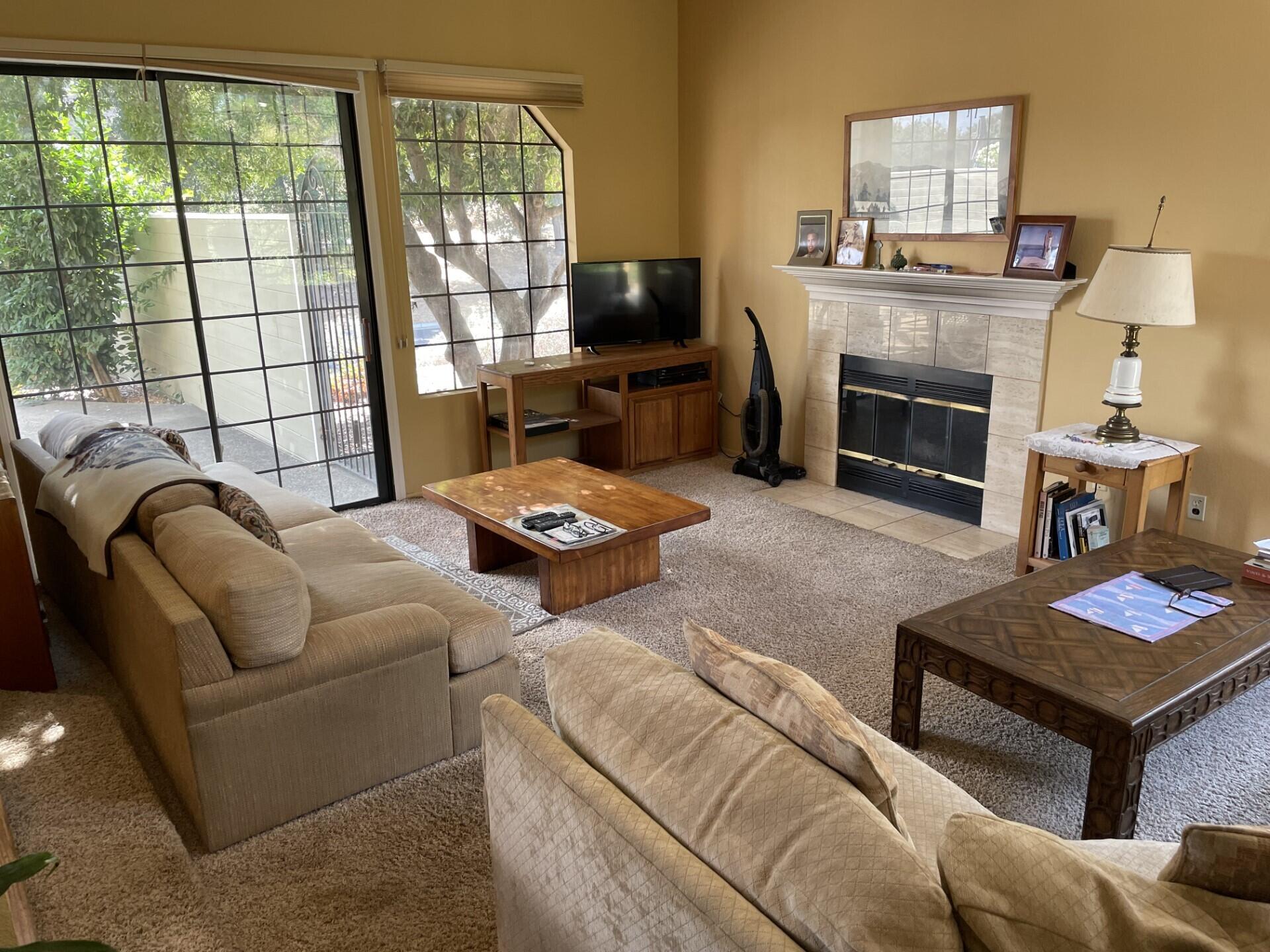 702 Hillside Drive Solvang, CA 93463 - Photo 4 of 15 a living room with furniture fireplace and a flat screen tv