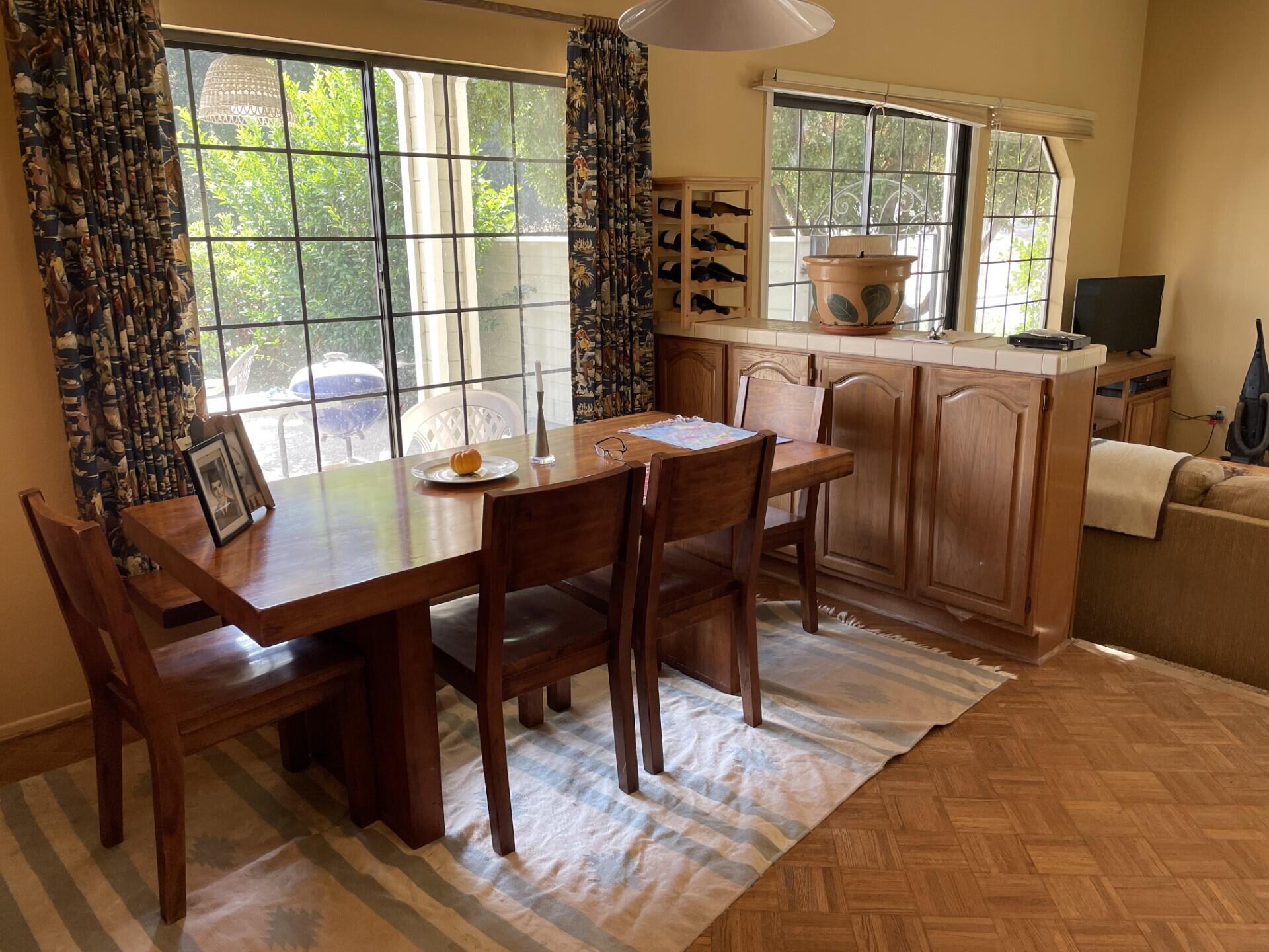 702 Hillside Drive Solvang, CA 93463 - Photo 5 of 15 a dining room with furniture a chandelier and wooden floor