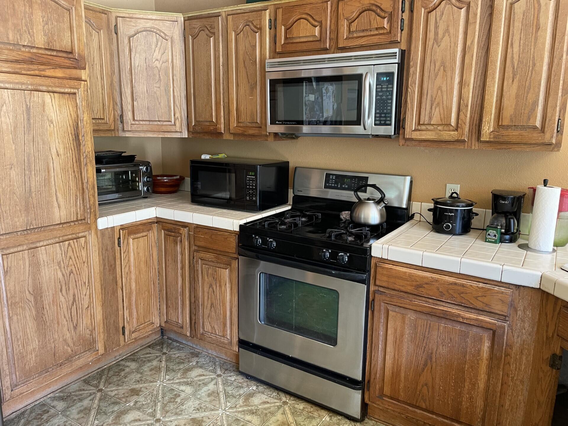 702 Hillside Drive Solvang, CA 93463 - Photo 6 of 15 a kitchen with a stove and a microwave