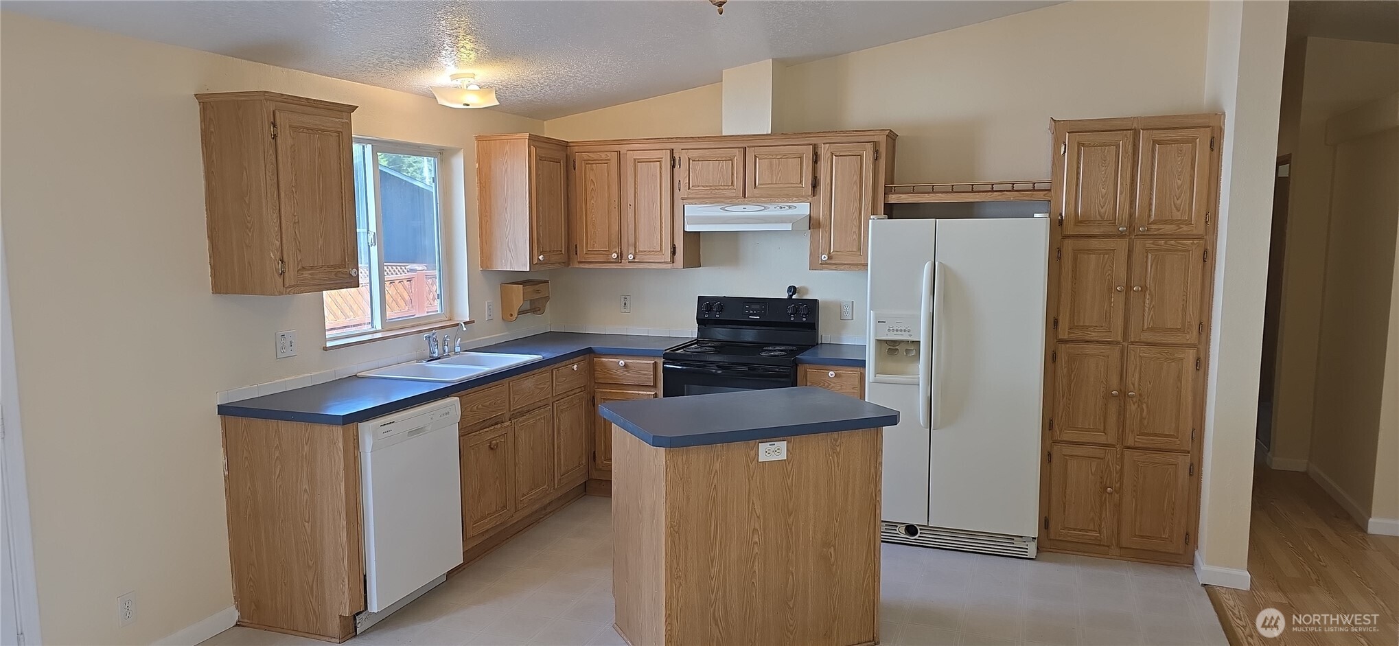 6164 Cedar Lane Maple Falls, WA 98266 - Photo 4 of 15 a kitchen with stainless steel appliances granite countertop a refrigerator a stove a sink and a refrigerator
