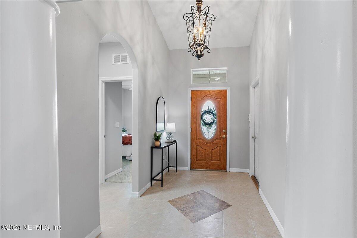 1053 Ridgewood Lane St. Augustine, FL 32086 - Photo 3 of 23 an entryway with a door and a rug