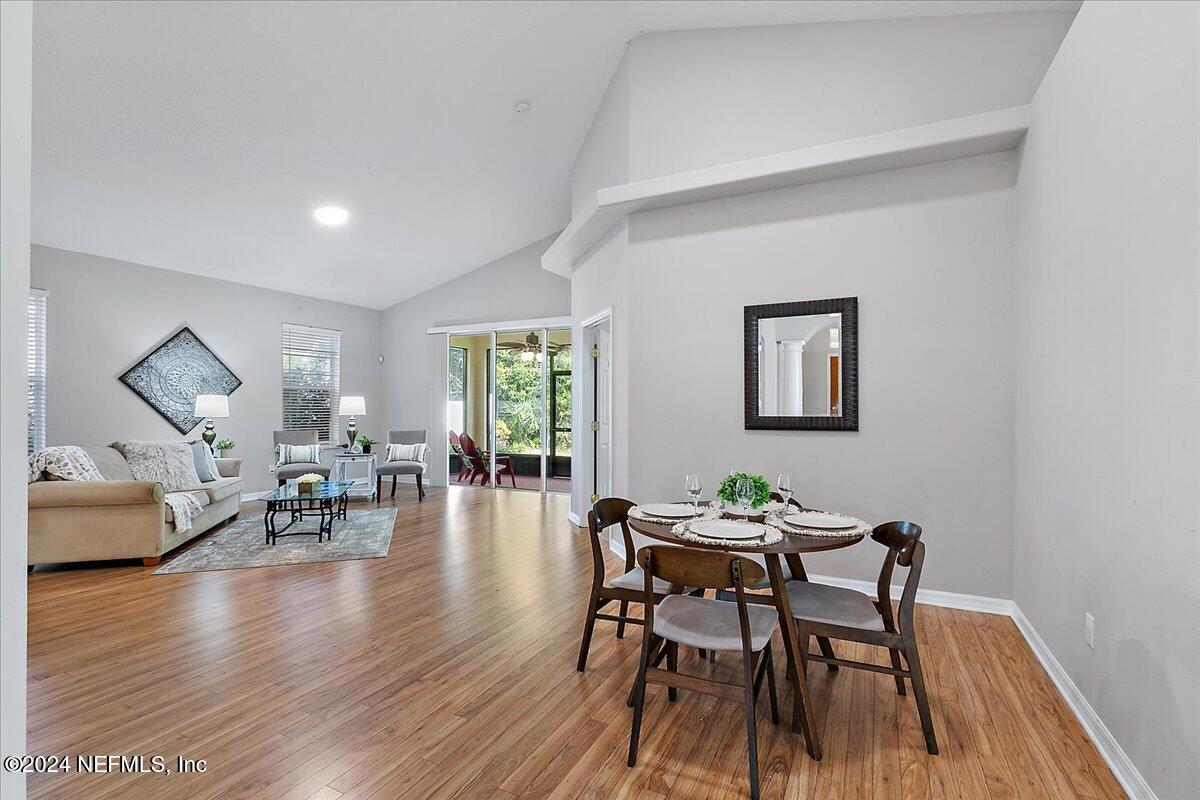 1053 Ridgewood Lane St. Augustine, FL 32086 - Photo 4 of 23 a view of a dining room with furniture and wooden floor