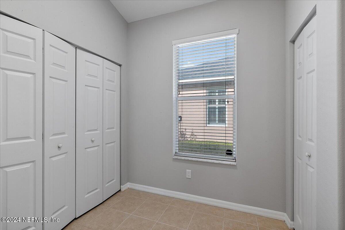 1053 Ridgewood Lane St. Augustine, FL 32086 - Photo 7 of 23 a view of a livingroom with an empty space and window