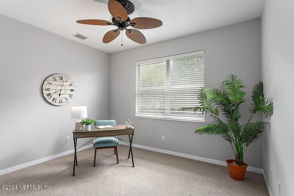 1053 Ridgewood Lane St. Augustine, FL 32086 - Photo 10 of 23 a workspace with furniture and a window