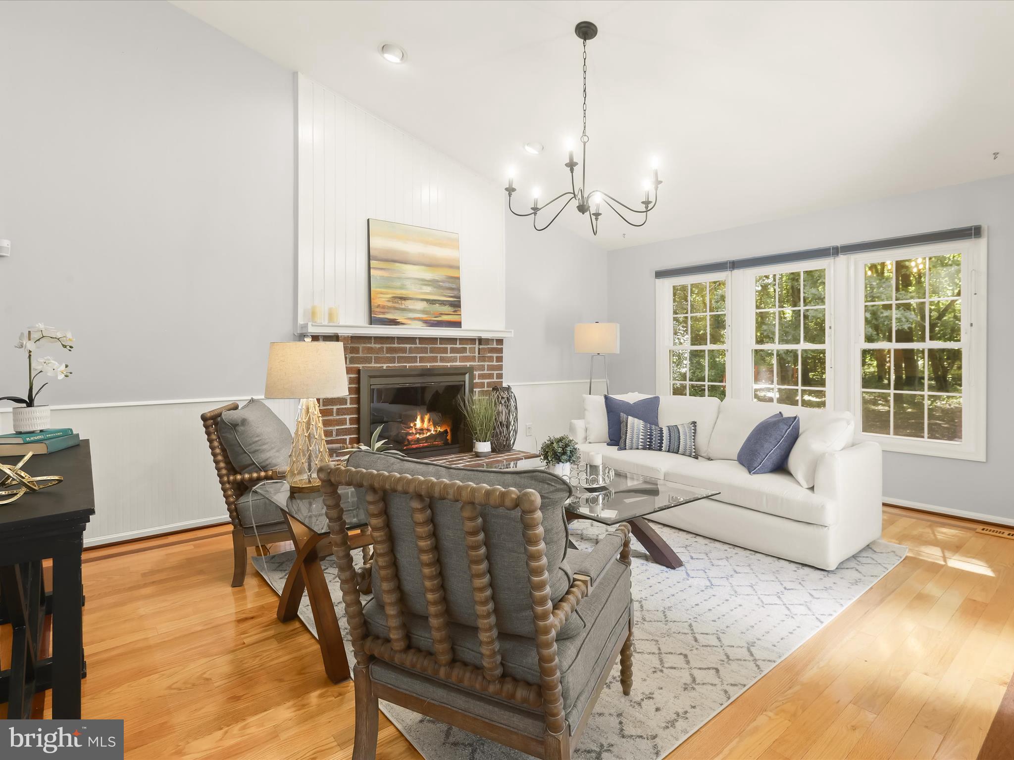 303 Riding Ridge Road Annapolis, MD 21403 - Photo 1 of 43 a living room with furniture a window and a fireplace